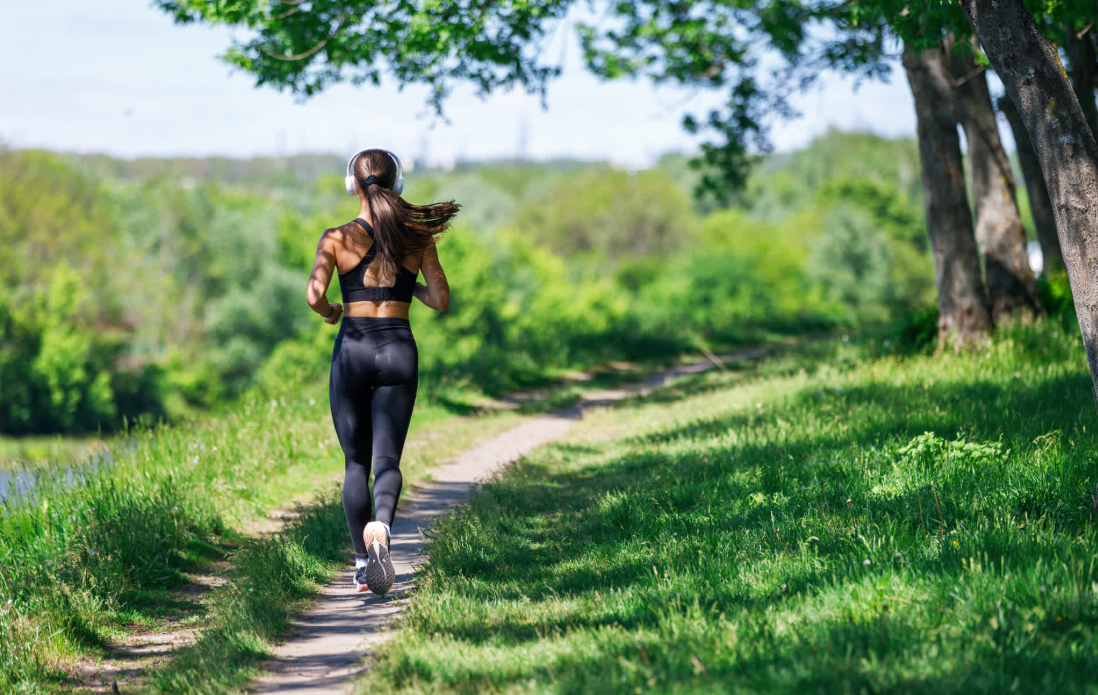 woman jogging alone on an empty pathway